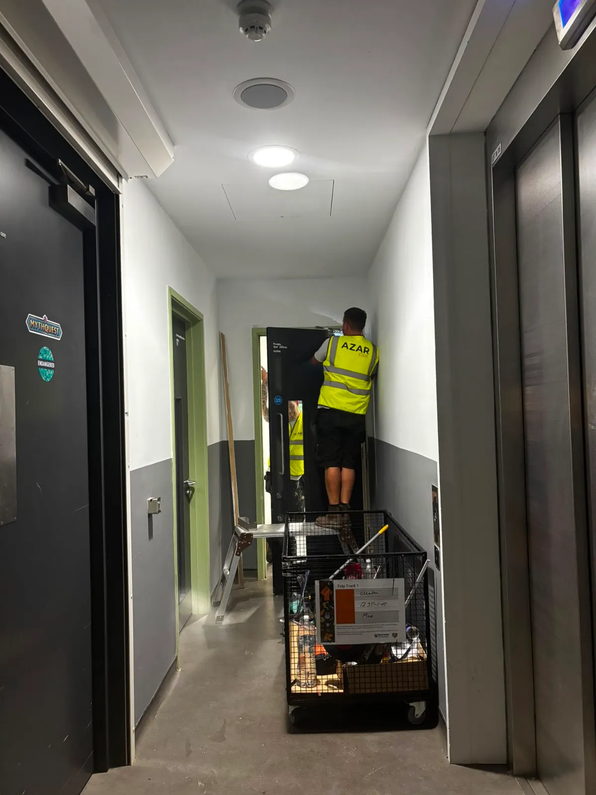 An Azar Fire operative fitting a heritage fire door on site