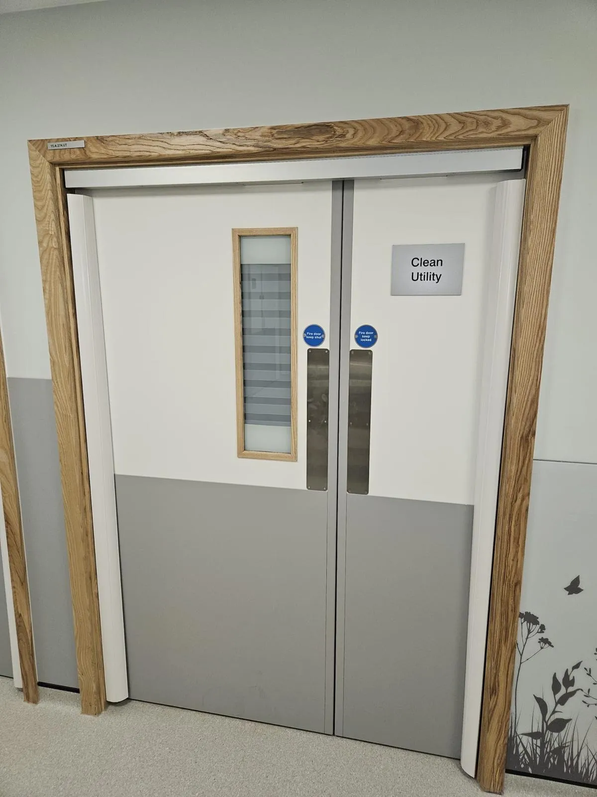 Fire-rated ash doorset to a Clean Utility room with a vision panel