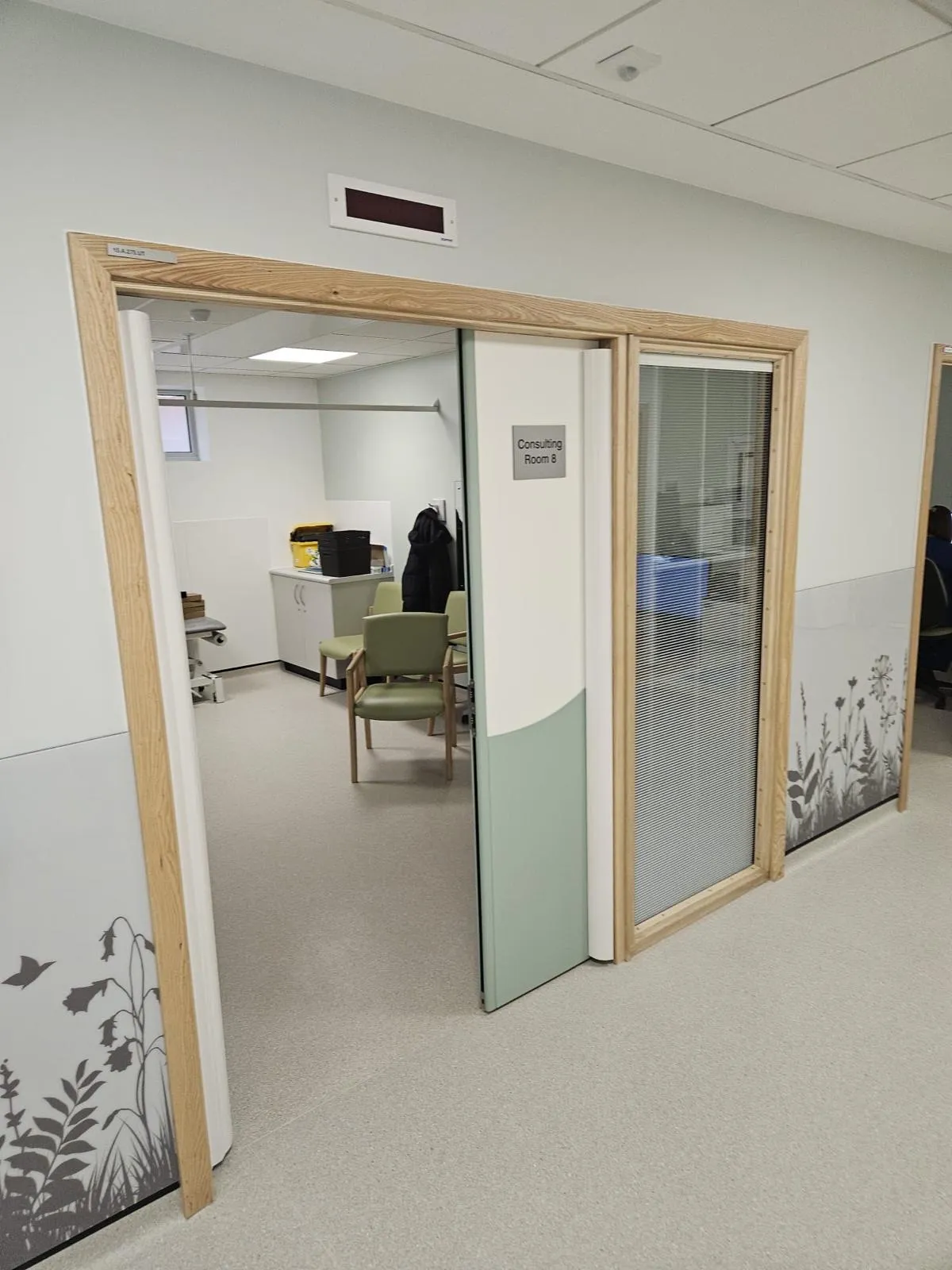 Fire-rated doorset with an adjacent glazed screen bringing in natural light