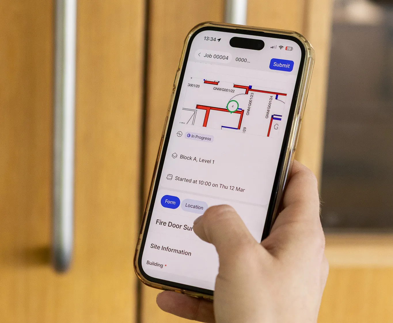 Azar Fire engineer logging a fire door installation on the One Trace app