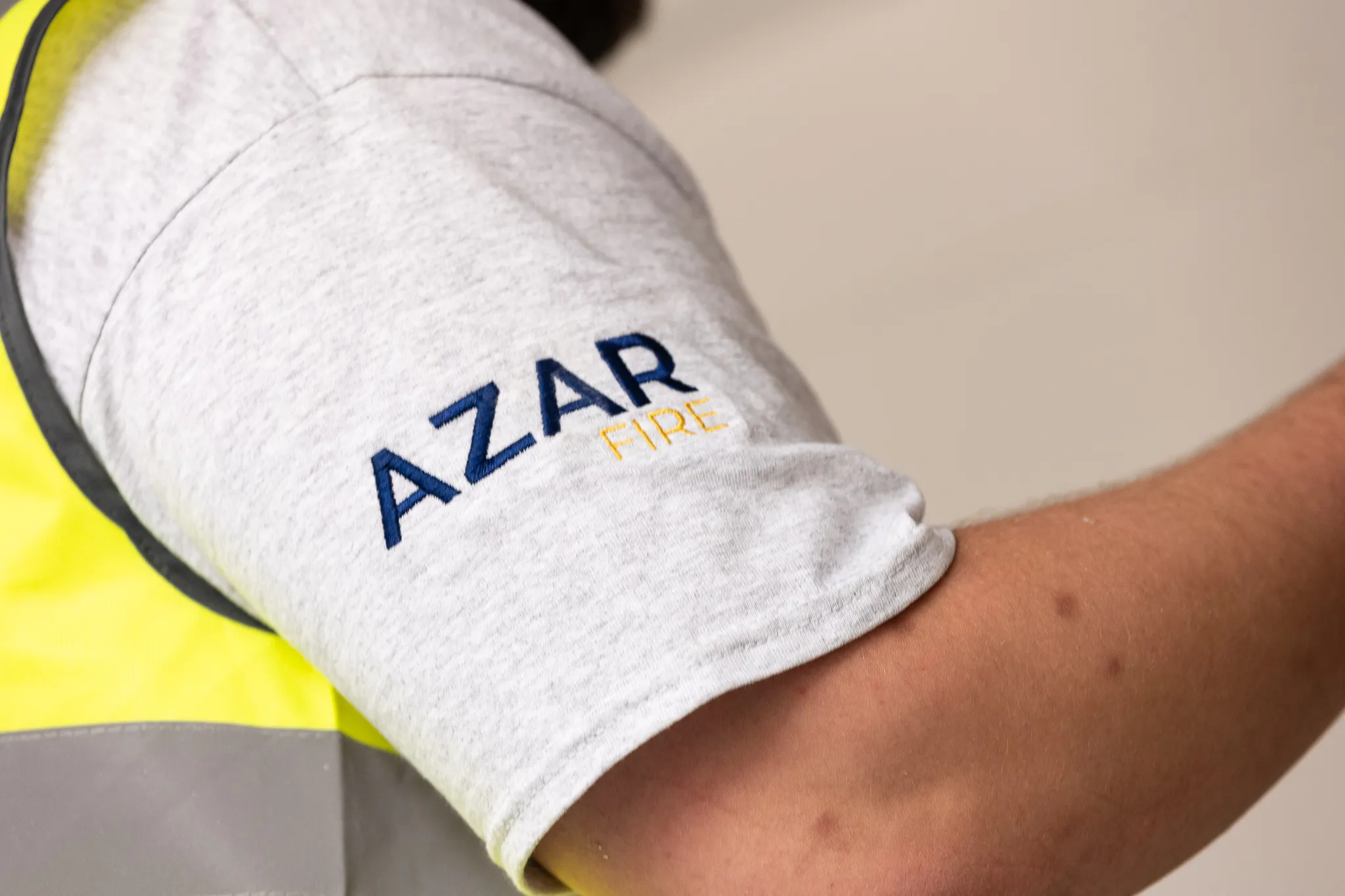 Azar Fire branded workwear, a close-up of the embroidered logo